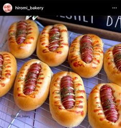 several hot dogs on buns with ketchup and mustard