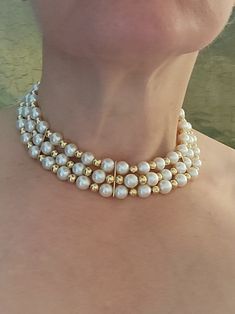 "The late Princess Diana Princess of Wales would have added this beautiful choker to her collection. This is an astounding heirloom piece! It would look stunning as a wedding choker or at a special event. Weighing 87.0 grams, this wonder is comprised of 64 round cream coloured Akoya cultured pearls with fair luster and thick nacre measuring approximately 9.00 - 9.5 mm in diameter and 62 round 14k yellow gold hollow beads measuring approximately 6.0mm in diameter. It has three 14k yellow gold spa Vintage Single Strand Jewelry For Wedding, Vintage Single Strand Wedding Jewelry, Vintage Pearl White Jewelry For Anniversary, Vintage Single Strand Wedding Necklace, Victorian Style Wedding Necklaces With Round Beads, Victorian Beaded Wedding Necklace, Vintage Bridal Necklace With Round Beads For Wedding, Classic Gold Choker For Wedding, Single Strand Costume Jewelry Necklace For Wedding