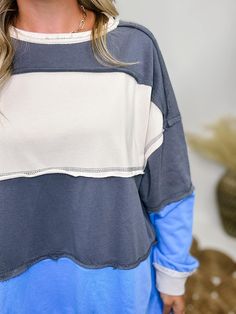 Blue, Cream, and Grey Colorblock Oversized Sweatshirt with Pockets Get ready to cozy up in style with our Blue, Cream, and Grey Colorblock Oversized Sweatshirt! This sweatshirt features a trendy colorblock design with shades of blue, cream, and grey, offering a modern and chic look. Made with a soft blend of 80% cotton and 20% spandex for the main fabric, and a contrasting blend of 94% cotton and 6% spandex, it’s both comfy and stretchy. The oversized fit ensures a relaxed vibe, while the handy Graphic Tops, Lounge Shorts, Chic Look, Kimono Jacket, Jean Leggings, Short Sleeved Sweaters, Oversized Sweatshirt, Platform Sneakers, Blue Cream