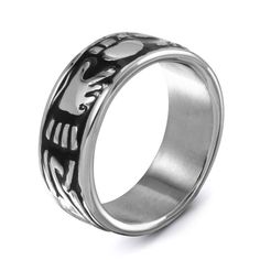 Traditionally known as a symbol of love, friendship and loyalty, the Irish Claddagh symbol is proudly sculpted across this elegant band. Fashioned in sleek and durable stainless steel, this 9.0mm wide band features the Claddagh symbol outlined in bold black enamel. Polished to a brilliant shine, this ring makes a thoughtful wedding band for him. Custom made to fit his ring size. Stainless steel rings cannot be resized after purchase. Symbolic Stainless Steel Jewelry For Wedding, Symbolic Stainless Steel Engraved Ring For Anniversary, Wedding Band For Him, Claddagh Symbol, His Ring, Wedding Bands For Him, Irish Claddagh, Black Wedding Band, Bold Black