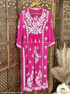 Rani Pink Premium Chikankari Kurti, Handmade Chikankari Kurta, Lucknow Chikankari Hand Embroidered Dress for Women, Festive Wear For Her Handmade with Love ❤ Fabric: Crepe Length: 44-46 Inches Sleeves: 3/4 Sleeves Occasions: Casual Wear, Office Wear, Festive Wear Garment Care: Hand Wash Only Net Content: 1x Kurti Shop by Category: Chikankari Kurtis: https://www.etsy.com/shop/Chikanlabelbykomal?ref=seller-platform-mcnav§ion_id=41848336 Chikankari Kurta Sets: https://www.etsy.com/shop/Chikanlabelb Chikankari Embroidery Dresses For Traditional Ceremonies And Festivals, Chikankari Embroidered Dress For Traditional Ceremonies And Festivals, Festival Dresses With Chikankari Embroidery For Traditional Ceremonies, Bohemian Embroidered Dress For Diwali, Bohemian Dress With Intricate Embroidery For Diwali, Chikankari Embroidery Dresses For Diwali And Traditional Ceremonies, Bollywood Style Chikankari Embroidered Dresses For Ceremonies, Bollywood Style Chikankari Embroidered Dress For Navratri, Bollywood Style Dresses With Chikankari Embroidery For Navratri