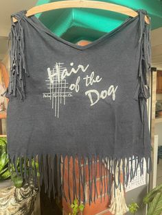 a t - shirt with fringes on it that says, rain of the dog