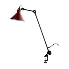 a red and black desk lamp on a white background with clippings to the side