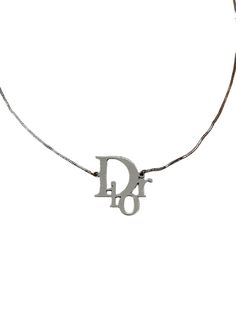 Christian Dior Necklace Silver Logo Monogram Vintage Authentic Y2K Total length 41cm Adjustable from 36cm Vintage - Good condition with signs of tarnish. Hallmarked Dior ⭐ 100% Authentic ⭐ FREE WORLDWIDE SHIPPING 🌎 Luxury Silver Jewelry With Logo, Luxury Sterling Silver Jewelry With Logo, Vintage Silver Necklace With Logo Charm, Luxury Silver Monogram Necklace, Luxury Monogram Silver Necklace, Luxury Monogram White Gold Necklace, Luxury White Gold Monogram Necklace, Christian Dior Necklace, Authentic Y2k