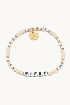 Let’s celebrate all the wifeys in our lives! Gift this handcrafted faux pearl bracelet to the girlie who’s about to wed her prince charming or the woman who’s been happily married for two decades. Part of a Bigger Story: Little Words Project is all about spreading kindness and empowerment through words. By wearing this bracelet, you become part of a larger community that shares the power of words. Bead Pattern: Bling Bling Hand-crafted, faux pearl and crystal beaded bracelet Plated Brass Hardwar Elegant White Name Bracelet With Letter Beads, Personalized Beaded Wedding Bracelets, Adjustable Pearl Beaded Bracelets For Anniversary, Elegant Mother's Day Party Charm Bracelet, Elegant Beaded Bracelets With Letter Beads For Mother's Day, Elegant Letter Beads Bracelet, Elegant White Name Bracelet For Gift, Elegant Mother's Day Beaded Bracelets With Letter Beads, Adjustable Pearl Charm Bracelet For Wedding