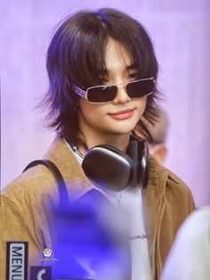 a person with sunglasses and headphones on