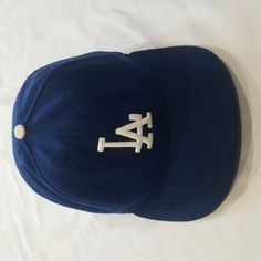 La Dodger Hat. Mens. One Size Fitted Hat 7 1/4 (57.7 Cm). Color Blue And White. Fabric Stretching/ Wear Inside, See Photos. Brand New Era Classic Blue Cap Hat, Classic Blue Baseball Cap With Flat Brim, Classic Blue Snapback Fitted Hat, Classic Blue Flat Brim Baseball Cap, Vintage Blue Snapback Fitted Hat, Classic Blue Baseball Cap, Classic Blue Fitted Baseball Cap, Vintage Blue Adjustable Fitted Hat, Classic Blue Baseball Cap One Size