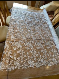 Beautiful,  white floral bridal lace with a scalloped edge. Amazing floral pattern with clear sequins for the shine, it is on a white net . This is the 4th design out of 11 that I have . It is 130 cm width please  note this is cut by meter (39") if you order 3m it will come in a continuous length! if you need a custom amount like a half a meter. please message me and we can work out a price White Scalloped Lace Dress For Wedding Night, White Lace Dress For Bridal Shower, White Scalloped Lace Dress For Bridesmaid, White Lace Bridesmaid Dress With Scalloped Lace, White Lace Dress With Lace Bodice, Wedding Night Lace Dress With Lace Back, Elegant Embroidered Fabric With Scalloped Lace For Wedding, White Scalloped Lace Embroidered Fabric, Wedding Embroidered Lace Fabric With Lace Trim