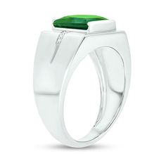 He'll love the eye-catching color of this modern ring. Crafted in cool 10K white gold, this design features a 9.0mm channel-set square-cut verdant-green lab-created emerald. Inlaid rows of diamond accents flank the center and continue along the grooved shank. Buffed to a brilliant luster, this ring makes a bold statement of style. Modern Emerald Ring With Diamonds, Modern Platinum Gemstone Rings, Modern 14k White Gold Diamond Ring, Modern White Gold Emerald Ring For Formal Occasions, Modern Emerald Rings With Center Stone, Modern Green Emerald Diamond Ring, Modern Green Diamond Ring For Formal Occasions, White Gold Emerald Ring With Polished Platinum Finish, Modern White Gold Emerald Ring With Vvs Clarity