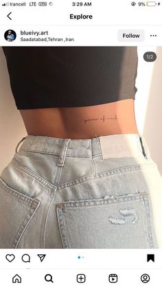 the back of a woman's stomach with an inscription on it