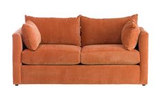 an orange couch with two pillows on it