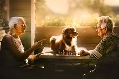 two elderly women playing chess with a dog sitting at the table in front of them