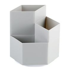 three white containers stacked on top of each other in the shape of hexagonal cubes