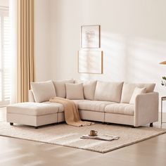 a living room with a sectional couch and coffee table on the floor in front of it