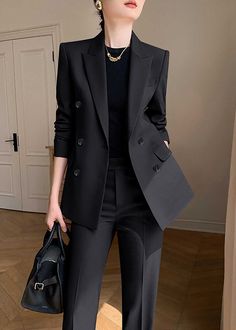 Elevate your professional wardrobe with the Monica Black Pants Suit Two-Piece Set. Crafted with a sophisticated black hue and double-breasted closure, this set exudes luxury and exclusivity. The straight-leg pants and tailored blazer provide a timeless and tasteful look for any business occasion. Blazer: Double Breasted closure Notched lapels Long sleeves Front flap pockets Pants Zip fly with button closure Side slant pockets Regular length - Polyester, spandex- Item #43197- Women's blazer & pan Double-breasted Office Wear Pantsuit With Double Button Closure, Black Office Lady Pantsuit, Chic Black Double-breasted Suit, Office Wear Pantsuit With Double Button Closure, Chic Black Double Breasted Suit With Long Sleeve, Chic Double-breasted Career Suit, Chic Black Double Breasted Suit, Double-breasted Tuxedo Style Pantsuit For Workwear, Chic Double-breasted Office Suit