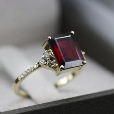 "Garnet Rhodolite and diamond ring Vintage inspired handmade Garnet Rhodolite and Diamond ring. This ring showcases a beautiful Crimson Garnet Rhodolite 8 x 6 mm Octagon cut surrounded by Excellently cut brilliant Diamonds. Handmade by an inspired jewelry artist team with decades of experience in the craft of jewelry making. Each gemstone, each diamond is carefully picked. Using only the finest raw materials and the highest industry standard in manufacturing, design and finish. A beautiful vinta Garnet Gold Ring, Gold Garnet Ring, Diamond Ring Vintage, Garnet And Diamond Ring, Garnet Engagement Ring, Garnet And Gold, Edwardian Style, Bling Wedding, Ruby Engagement Ring