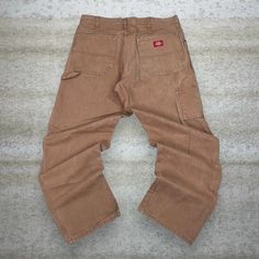 Vintage Dickies Carpenter Pants Camel Tan Canvas Baggy Fit Dungarees Work Wear Painters 90s Skate / Streetwear Great Condition: 9/10 Men's Size:  Waist: 34" Length (inseam): 32" Leg Opening: 9" Thigh Opening: 13" Front Rise: 13" 90s Style Cargo Pants With Pockets For Fall, 90s Style Bottoms With Pockets For Fall, 90s Style Cargo Pocket Bottoms For Fall, Casual Brown Cargo Pants With Belt Loops, Baggy 90s Bottoms With Side Pockets, 90s Style Baggy Pants For Fall, 90s Baggy Pants For Fall, Vintage Baggy High Waist Cargo Pants, 90s Style Relaxed Fit Pants For Fall