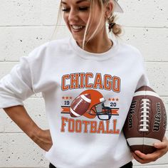 Get ready for game day with our retro Chicago sweatshirt! This vintage crewneck is perfect for football fans. A unique bear sweatshirt that's a must-have for any varsity football lover or Chicago gifts collector. Hello there! 😊👋 If you're on the hunt for some seriously cozy sweatshirts, you've come to the right place! I'm absolutely passionate about what I do, and my mission is to make your shopping experience absolutely perfect. If you ever have any questions, concerns, or just want to chat a Baseball Season Fan Gear Sweatshirt, Pre-shrunk Sweatshirt For Baseball Game Day, College Football Season Graphic Print Sweatshirt, Varsity White Sweatshirt For Football Season, Sports Fan Sweatshirt With Team Logo For Fans, Baseball Season Sweatshirt With Graphic Print For Fans, Sporty Baseball Season Fan Gear Sweatshirt, Sporty Baseball Season Sweatshirt Fan Gear, Sporty Baseball Season Sweatshirt For Fan Gear