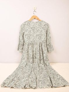 Sweet As Honey Floral Print Maxi Dress- White Modest Dress With Ruffle Hem, Modest White Dresses With Ruffle Hem, Modest Flowy Floral Dress With Ruffles, Cute V-neck Dresses For Fall, Spring Ditsy Floral Print Patterned Dress, Spring Patterned Ditsy Floral Print Dress, Flowy Tiered Printed Dress, Modest Ditsy Floral Print Dress For Brunch, Modest Ditsy Floral Dress For Brunch