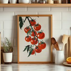 an orange is hanging on the wall next to a kitchen counter with utensils