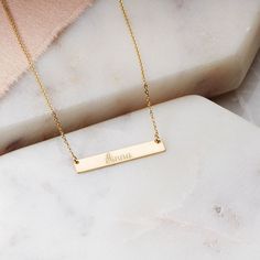 Ross-Simons - Name - 14kt Yellow Gold Petite Bar Necklace. 16". RS Pure. Modern designs that complete your outfit and complement your personality. Right on-trend with the minimalist movement, this petite bar pendant shines in polished 14kt yellow gold, stationed on a cable chain with a 2" extender. FREE engraving of a name with up to 12 characters in your choice of block or script type. Lobster clasp, 14kt yellow gold personalized petite bar necklace. Personalized Charm Necklace, Monogram Earrings, Sterling Silver Name Necklace, 16 Inch Necklace, Script Monogram, Gold Name Necklace, Script Type, Monogram Necklace, Disc Necklace