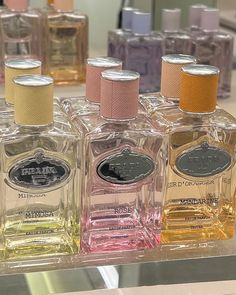 several bottles of perfume on display in a store