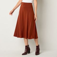 This chic earthy toned women's Liz Claiborne midi skirt will add an on-trend seasonal touch to your wardrobe for office or casual looks. Cut for a mid-rise from smooth stretch-ponte, it has a comfortable elastic waistband and a full flowy skirt. Wear it with a fitted t-shirt or sweater with ankle boots.Front Style: Flat FrontClosure Type: Full ElasticRise: Mid RiseApparel Length: 32.5 InchesFiber Content: 98% Polyester, 70% Rayon, 25% Modal, 5% SpandexFabric Description: PonteLining: UnlinedSkir Long Fall Skirts, Wardrobe For Office, Long Skirt Fall Outfits, Midi Skirt With Boots, Corduroy Midi Skirt, A Line Skirt Outfits, Tall Skirt, Full Midi Skirt, Skirts With Boots