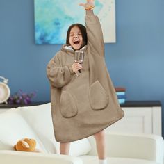 Pavilia Faux Shearling Wearable Blanket Hoodie for Kids KIDS WEARABLE HOODIE BLANKET: Made with super soft microfiber fleece and special designed reversible faux-fur fluffy faux shearling lining, this oversized wearable blanket is the perfect sweater and blanket all in one that keeps your hands free. COMFORT AND PLUSH: Made from 450 GSM of 100% premium microfiber fleece polyester, and faux shearling lined inside for extra warmth and comfort. This blanket sweatshirt is super soft, comfortable and Giant Hoodie, Blanket Sweatshirt, Perfect Sweater, Sweatshirt Blanket, Oversized Blanket, Blanket Hoodie, Hoodie Blanket, Wearable Blanket, Remote Controls