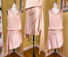 vintage 1920s dress -- a lovely party dress! so pretty + chic, would make an excellent choice for bridal wear.  ➡ softly shiny pink champagne oyster silk satin, with subtle hammered texture  ➡ straight cut bodice drapes nicely along the dropped waist, lined with sheer mesh  ➡ wide bands of shirring across the shoulders  ➡ asymmetric skirt features a shorter wrapped base, with whisker darting across the right hip -- this is them topped with a glass buckle, finished with a long sash drape. the oth 1920s Silk Dress, Silk Drape Dress, 20s Dress, Asymmetric Skirt, Draped Skirt, 1920s Dress, 20's Dress, Asymmetrical Skirt, Pink Champagne