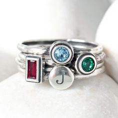 "This set of rings is a wonderful gift for the mother or grandmother of three, or to represent three family members. Add to your set over time to create a continuously changing ring! Wear a birthstone band to represent each member of your family, pet, or children. You can even wear your own birthstone! **This listing is for three sterling silver birthstone rings. Each ring has one set Swarovski crystal stone.** Want more than 3 bands in your set? Create your own stack of Initial & Birthstone Rings With Birthstones, Sterling Silver Birthstone Ring, Three Family, Birthstone Band, Set Of Rings, Stackable Birthstone Rings, Mother's Ring, Multiple Rings, Birthstone Rings