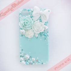 an iphone case with flowers and pearls on it