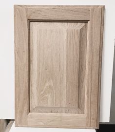 a close up of a wooden cabinet door