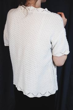 "80s/90s very cute vintage short sleeve sweater top in white knit, a perfect summer cottagecore sweater top Size L / M , or wear it as an oversize. Great vintage condition, no flaws, no stains, clean and ready to wear. Model in the photo is an EU 38 size (S/M) ● Era : late 80s/early 90s ● Label : Berkertex ● Fabric composition % : no tags but surely cotton by texture and weight ● Size on tag : no size tag ● How it fits : soft and nice cotton knit in white ● Condition : very good vintage conditio White Knit Blouse With Crew Neck, Cream Short Sleeve Knit Sweater, Hand Knitted Cream Knit Tops, Cream Hand Knitted Top, Vintage Cream Knit Tops, Cream Short Sleeve Sweater With Pointelle Knit, Vintage Crochet Crew Neck Tops, White Knitted Short Sleeve Sweater, White Short Sleeve Knit Cardigan