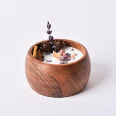 a wooden bowl filled with some kind of food