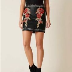 Floral Embroidered Faux Leather Lined 16" Skirt Back Zipper Detail Model Info: Height: 5'8" | Bust: 33 1/2" | Waist: 25 1/2" | Hip: 36" | Wearing Size: Small Chic Fitted Skirt With Floral Embroidery, Floral Embroidered Fitted Mini Skirt, Floral Embroidered Mini Skirt For Party, Party Mini Skirt With Floral Embroidery, Fitted Embroidered Skirt For Fall, Fitted Embroidered Fall Skirt, Embroidered Fitted Skirt For Fall, Fall Embellished Fitted Skirt, Embellished Fitted Skirt For Fall