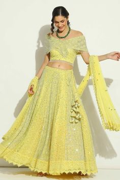 Yellow attached cancan lehenga with chikankari, swarovski embroidery in geometric pattern. Paired with off-shoulder embroidered padded blouse and cutwork border embroidered dupatta. - Aza Fashions Party Wear Lehenga With Chikankari Embroidery For Reception, Party Wear Sets With Chikankari Embroidery For Reception, Party Wear Georgette Lehenga With Chikankari Embroidery, Fitted Lehenga With Chikankari Embroidery For Party, Party Choli With Chikankari Embroidery On Georgette, Diwali Party Lehenga With Chikankari Embroidery, Party Wear Lehenga With Chikankari Embroidery, Festive Party Lehenga With Chikankari Embroidery, Bollywood Party Choli With Chikankari Embroidery