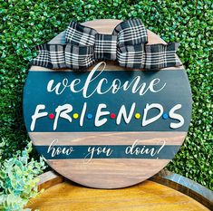 a wooden sign that says welcome friends for you down