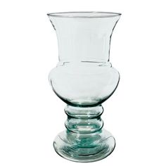 a clear glass vase sitting on top of a table