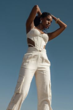 Introducing the Ivory Horizon Linen Corset – the perfect blend of style and support. Crafted from fresh linen fabric, this corset top features adjustable shoulder straps and padded bra cups. The lace-up closures, along with front and back boning, provide a flawless fit, while contrasting mesh panels add a unique touch of elegance. Pair with our Better Half Linen Utility Pants for the full look. Minimal stretch. Minimal stretch. Double lined. Materials: 30% Linen 67%Viscose 3%Spandex (contrast) 1 Linen Corset, Fresh Linen, Utility Pants, Full Look, Better Half, Padded Bra, Bra Cups, Corset Top, Linen Fabric