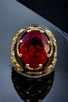 Luxury Handmade Ruby Ring, Luxury Formal Ruby Ring With Stone Setting, Luxury Ruby Ring With Stone Setting For Formal Events, Luxury Ruby Ring With Stone Setting For Formal Occasions, Luxury Handmade Ruby Ring For Formal Occasions, Luxury Ruby Signet Ring Hallmarked, Luxury Hallmarked Ruby Signet Ring, Elegant Red Ceremonial Rings, Luxury Red Jewelry For Ceremonial Occasions