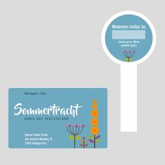 a business card with flowers on it next to a magnifying glass that says sommekraut