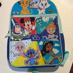 Send The Kids Back To School Or The Disney With Disney 100th Anniversary Backpack. A Keepsake For Sure! Disney Character Print Backpack, Cute Multicolor Backpack For Disney Trips, Character Style Backpack For Disney Fan Events, Disney Backpack For End Of School Year, Disney Blue Standard Backpack, Disney Style Standard Backpack, Themed Blue Backpack For End Of School Year, Disney Multicolor Backpack For Back To School, Disney Themed Standard Backpack For Disney Trips