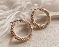 💖 Looking for the perfect Christmas gift for your daughter? Look no further than these stunning pink celestial earrings! Handmade with love, these gold seed bead hoop earrings are aesthetic choice that she will love. Treat your loved one to these one-of-a-kind earrings that are sure to make her feel like a celestial beauty! These unique beaded hoop earrings are not only stylish but also comfortable to wear all day long * MATERIALS * Hoops are made of high quality Japanese seed beads. Because of Hypoallergenic Pink 14k Gold Filled Jewelry, Multicolor Tiny Beads 14k Gold Filled Jewelry, Handmade Multicolor 14k Gold Filled Jewelry, 14k Gold Filled Multicolor Tiny Beads Jewelry, Trendy Small Hoop Jewelry With Tiny Beads, Pink 14k Gold Filled Jewelry For Gift, Pink 14k Gold Filled Jewelry Gift, Gift Dangle Hoop Earrings With Spacer Beads, Trendy Hoop Earrings With Tiny Beads For Gift