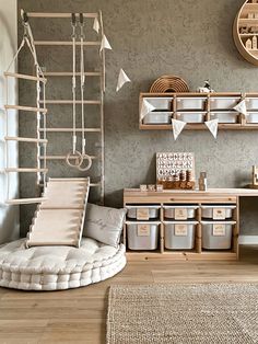 a living room filled with lots of furniture and storage space next to a wall mounted clock