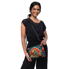 🐉Keep your style on point and your hands free with our Women's Versatile Crossbody Bag/Purse with a Gold, Teal & Red Mystical Dragon Design. It's made of premium faux leather and features dark gray hardware. Thanks to the zip-top closure and multiple inside pockets, you can keep your essentials secure and organized. Transform this crossbody bag with removable wrist and shoulder straps to style it for day-to-night looks. * Outer fabric: faux leather  * Lining: 100% polyester * 11″ × 8″ × 1.5″ (2