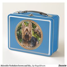 a blue lunch box with a photo of a dog on it