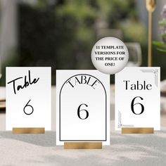 three place cards with the table 6 and 6 written in black ink on white paper