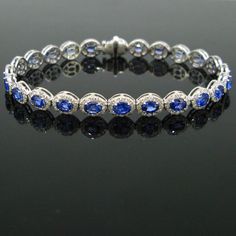 Weight:12.88gr Metal:18kt white gold Stones:24 Sapphires *Cut:Oval *Total Carat Weight:7.39t  Others:312 diamonds *Cut:Round *Total carat weight:2.83ct Condition:New Comments:This ravishing riviere bracelet is made in 18kt white gold. It is adorned with 24 vibrant blue sapphire, each surrounded with brilliant cut diamonds. There is a total carat weight of 7.39ct of sapphires and 2.83ct of diamonds. It is beautiful bracelet and in excellent condition.  Dimensions:Length:  18cm / 7in Width: 6.50mm Oval Diamond Bracelet With 17 Jewels, Luxury Sapphire Diamond Round Bracelet, Luxury Sapphire Diamond Bracelet, Luxury White Gold Sapphire Diamond Bracelet, Luxury Diamond White Oval Diamond Bracelet, Luxury Oval Diamond White Diamond Bracelet, Oval White Gold Diamond Bracelet With Diamond Accents, Luxury Sapphire Diamond Bracelet For Formal Events, Luxury Sapphire Diamond Bracelet For Formal Occasions