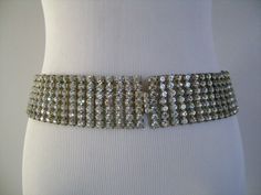 "This is a Stunning Vintage Blinding Sparkling Round Cut Chaton Diamante Rhinestones Fancy Bridal Wedding Belt Sash or Necklace Silver Tone Metal Fabulous Well Made a Great Quality Vintage Piece! The belt measures from end to end is 29-1/4\" long by 1-7/8\" wide,The belt is in very good vintage condition with little/minor signs of wear due to its age, the silver tone finish at the back of the belt little bit discoloration. NO missing rhinestone, all rhinestones are sparkle beautiful very clean a Silver Fitted Sash For Party, Fitted Silver Sash For Party, Fitted Rhinestone Sashes For Party, Party Fitted Sashes With Rhinestones, Silver Rhinestone Sashes For Formal Occasions, Silver Rhinestone Sashes For Party, Silver Rhinestone Sash For Formal Occasions, Silver Rhinestone Party Sashes, Formal Silver Sashes With Rhinestones