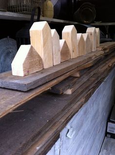 several pieces of wood sitting on top of a wooden table